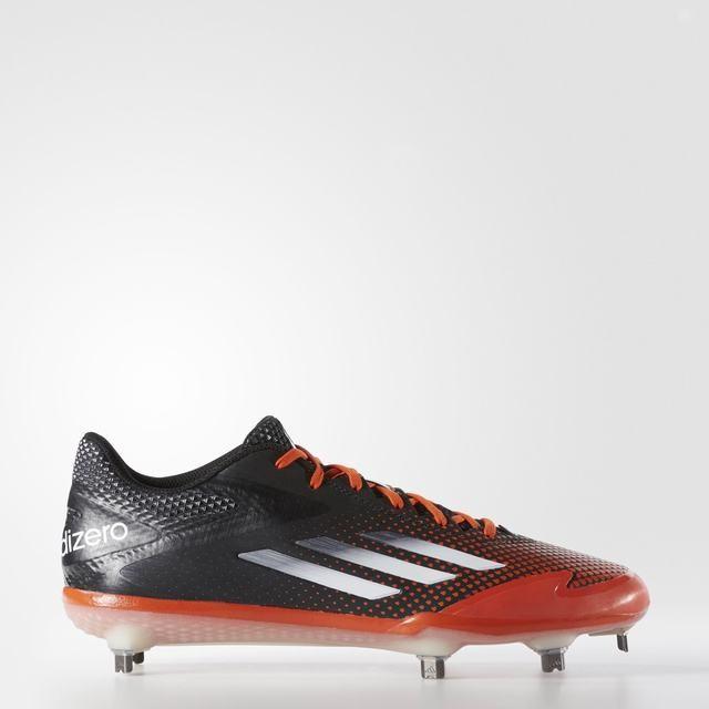 orange and black metal baseball cleats