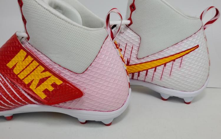 pink and yellow football cleats