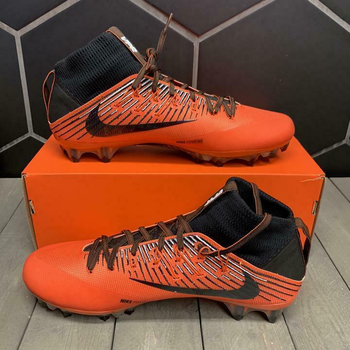 orange and black football cleats