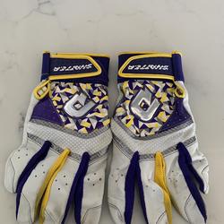 purple and yellow batting gloves