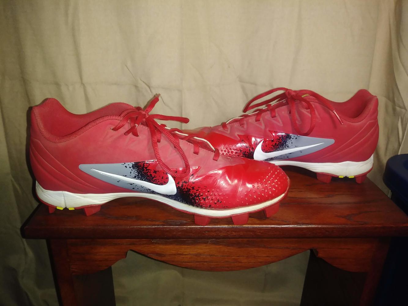 red molded baseball cleats