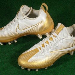 nike gold and black football cleats