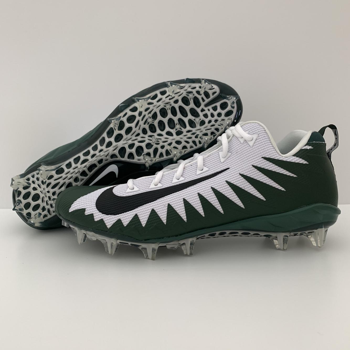green and black football cleats