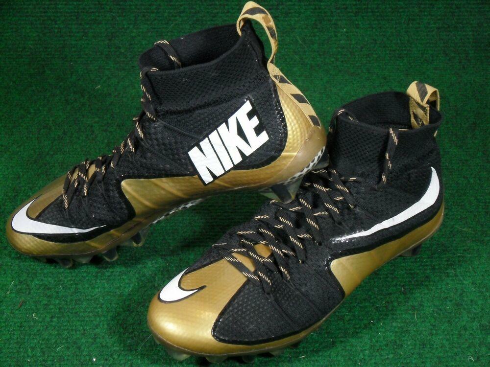 black and gold nike football cleats