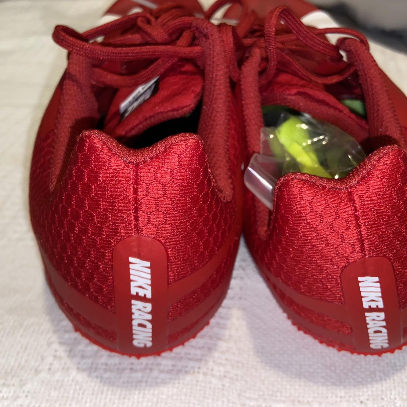 grey and red nike cleats
