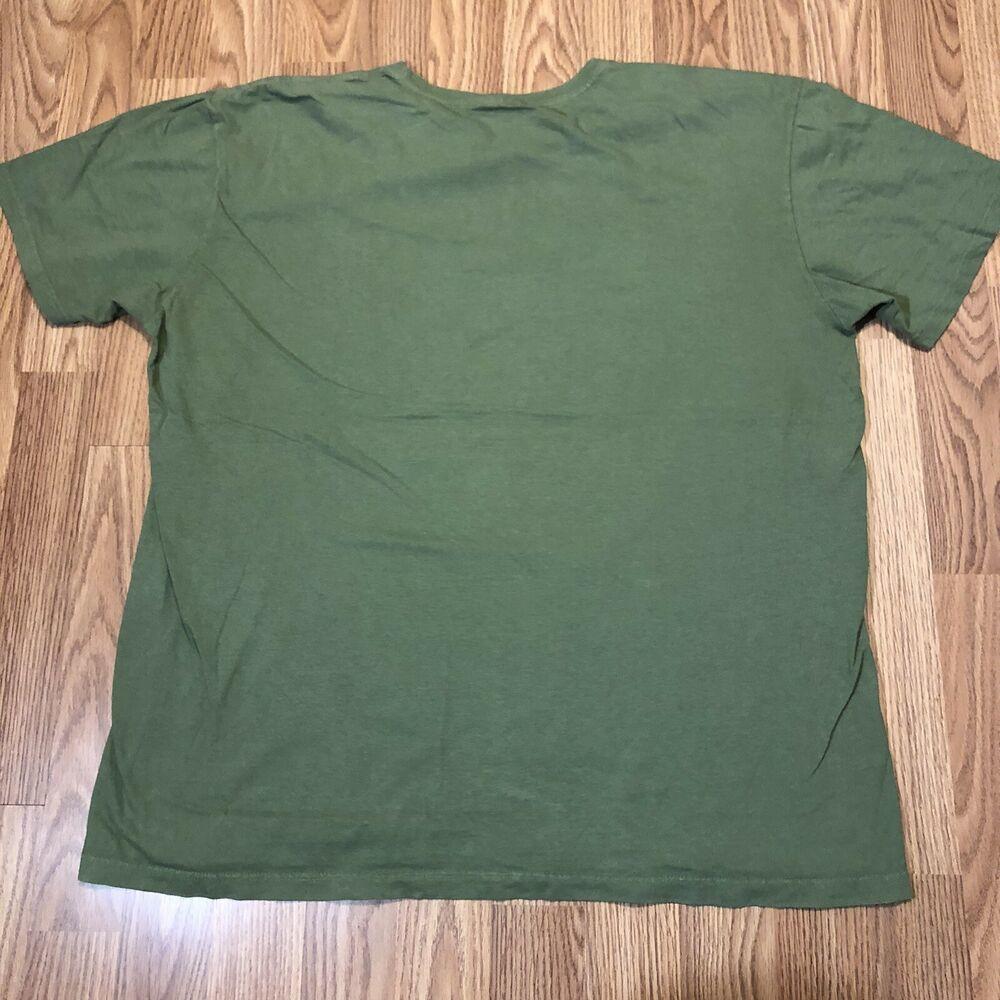 orange polo shirt with green horse