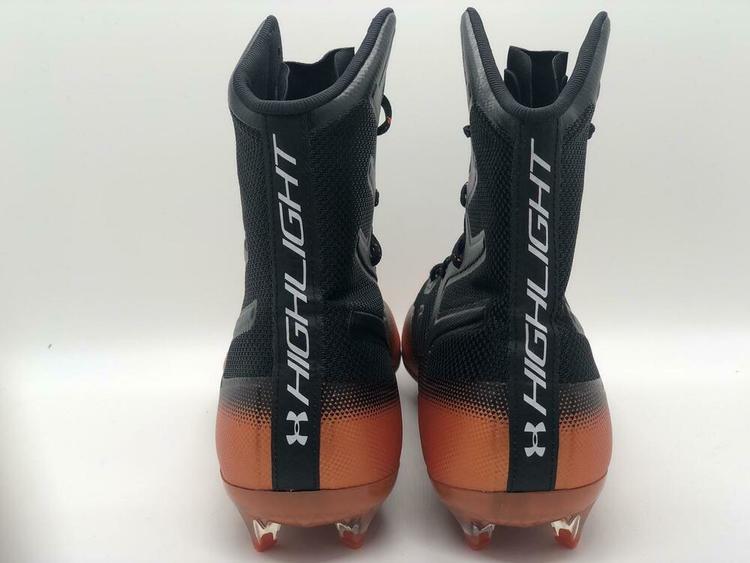 orange and black under armour football cleats