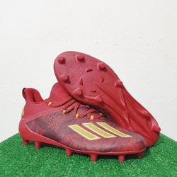 gold and red football cleats