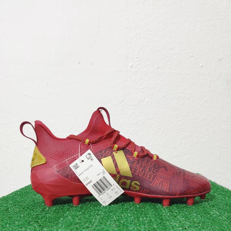 red and gold adidas football cleats