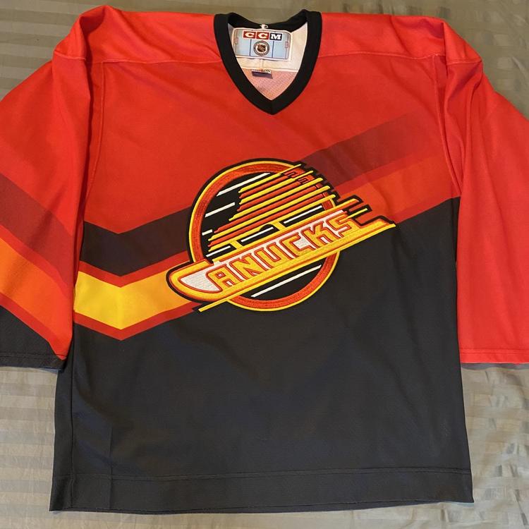 canucks red skate jersey