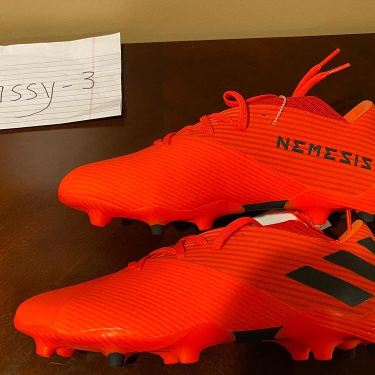 orange adidas cleats