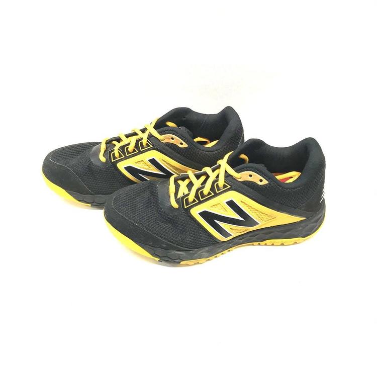 new balance black and yellow turf shoes
