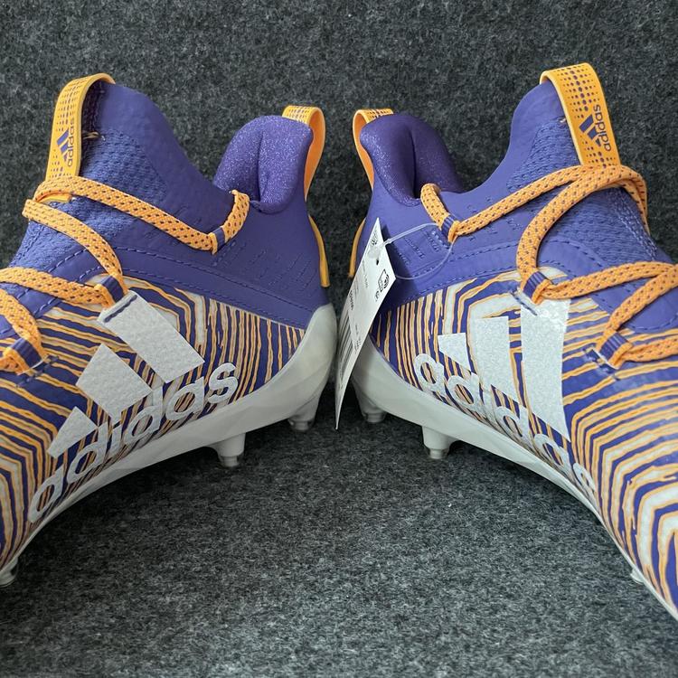 purple and gold football cleats