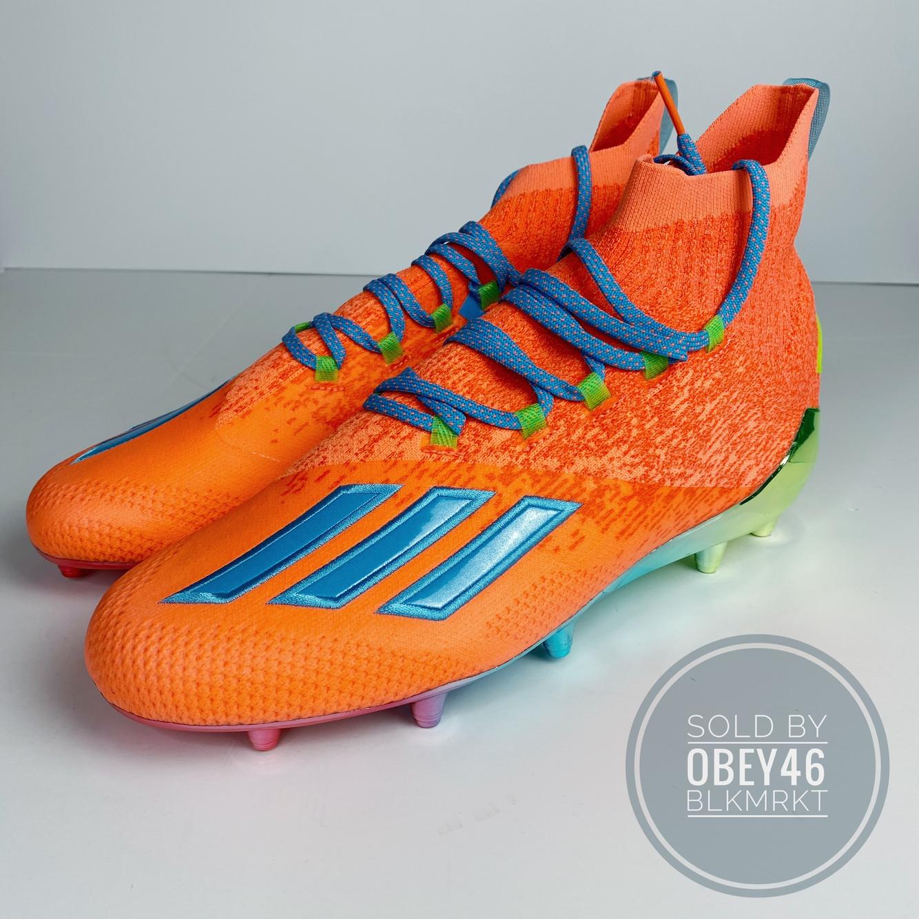 orange football cleats size 7