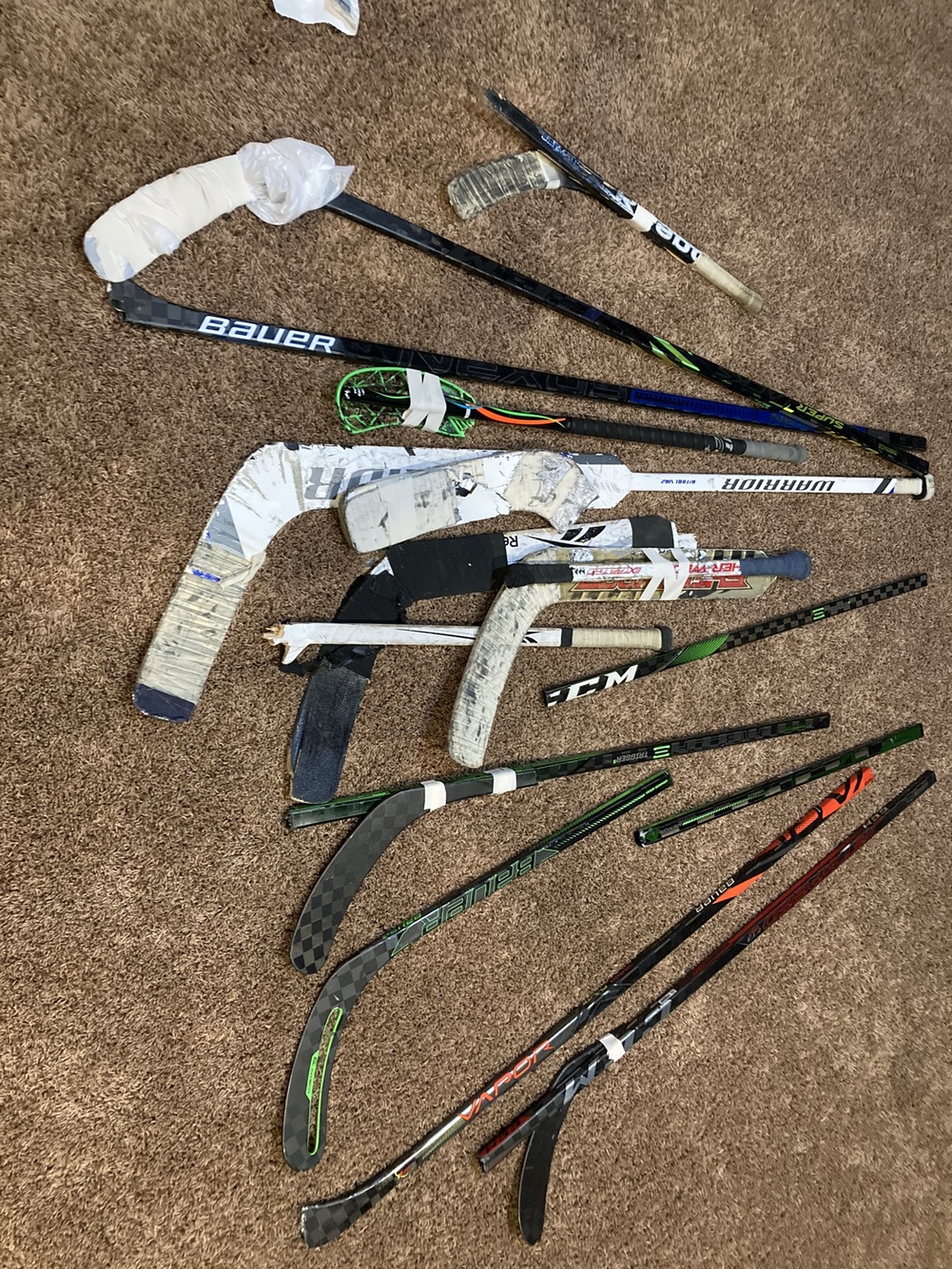 Pile of Broken Hockey Sticks SidelineSwap