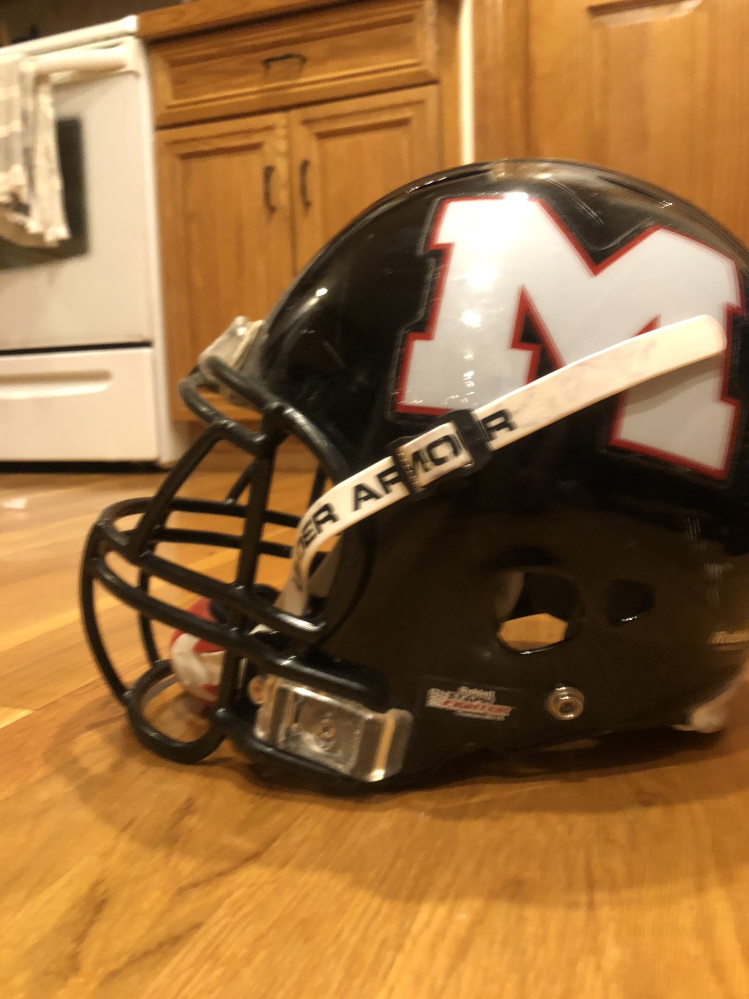 Medium riddell football helmet with under armour chin strap SidelineSwap