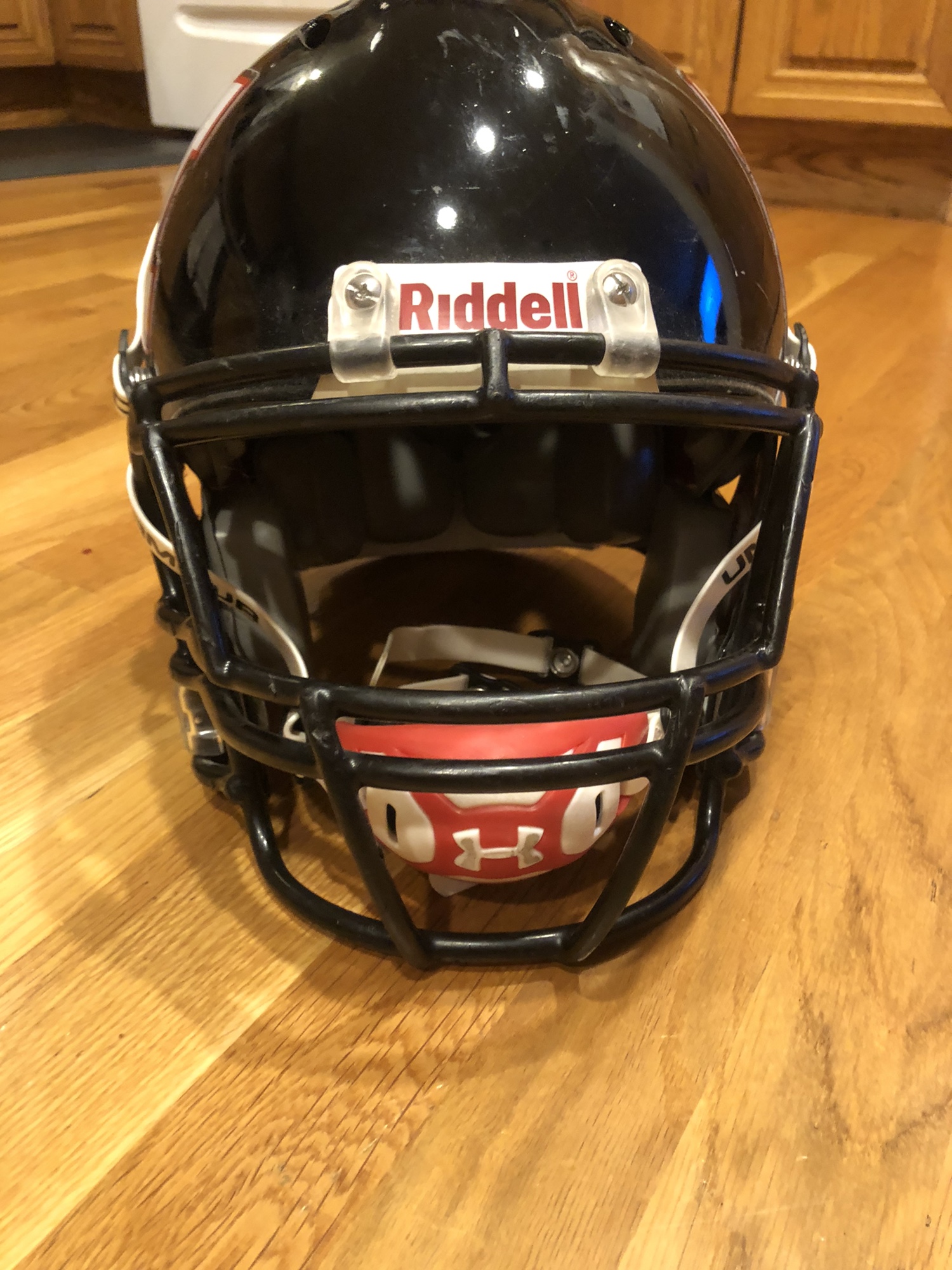 Medium riddell football helmet with under armour chin strap SidelineSwap