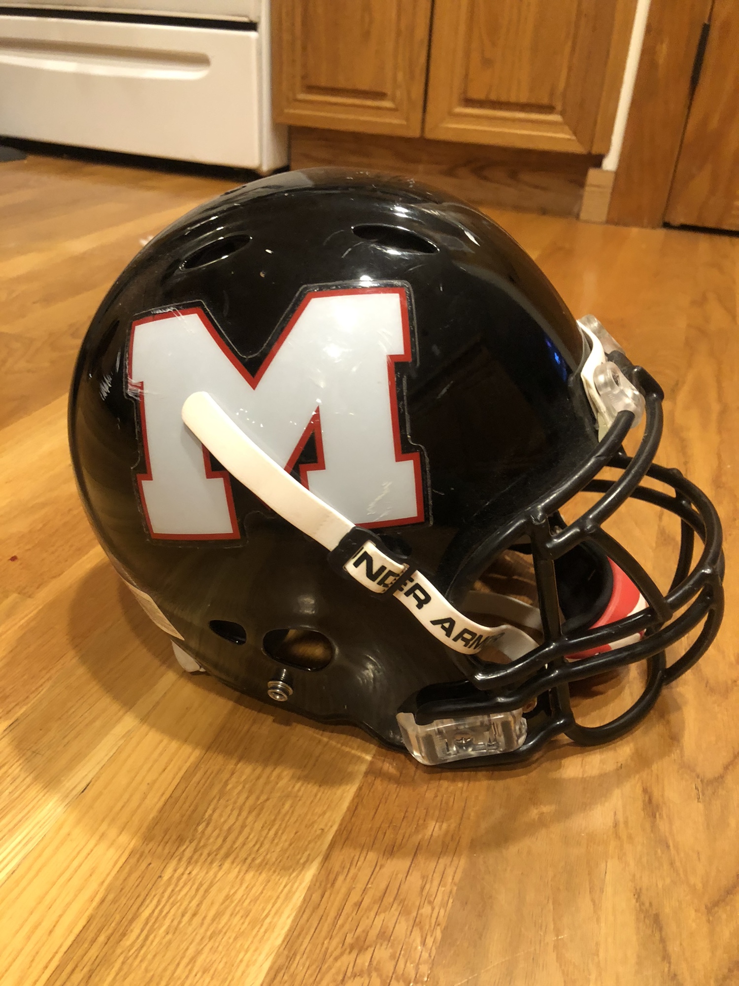 Medium riddell football helmet with under armour chin strap SidelineSwap