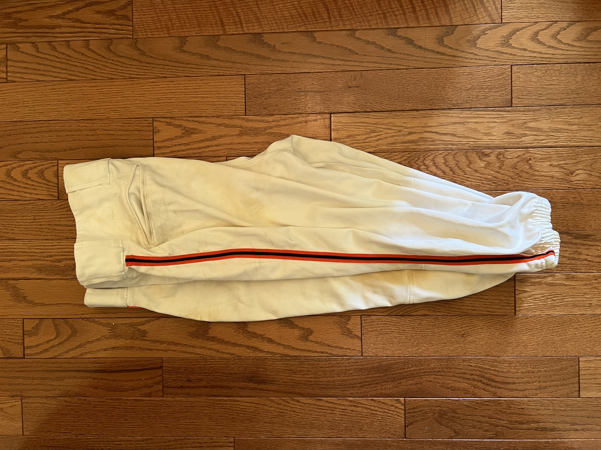 White baseball pants , orange and black side Piping SidelineSwap