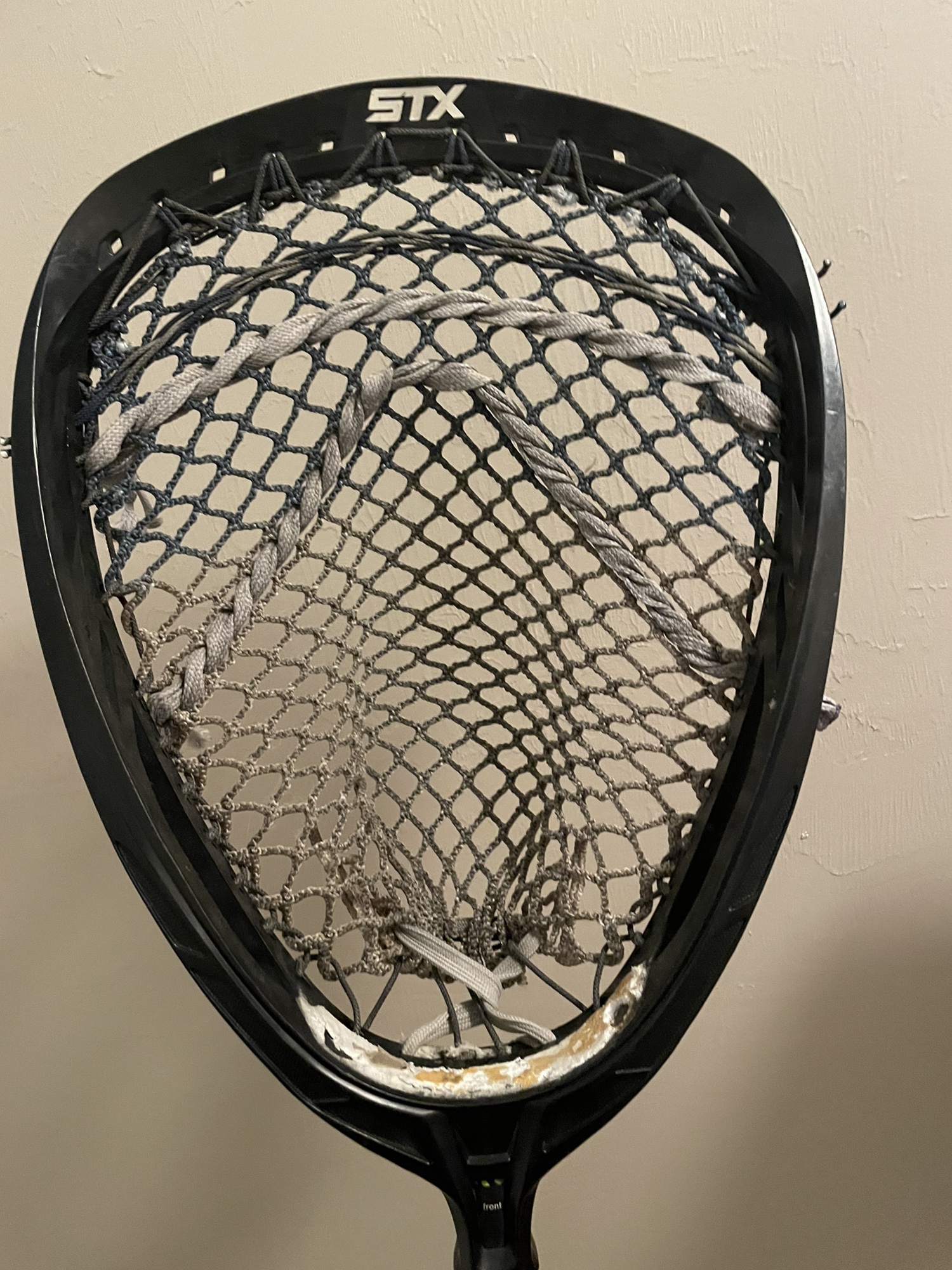 Lacrosse goalie stick with shield head monster mesh and dragonfly shaft