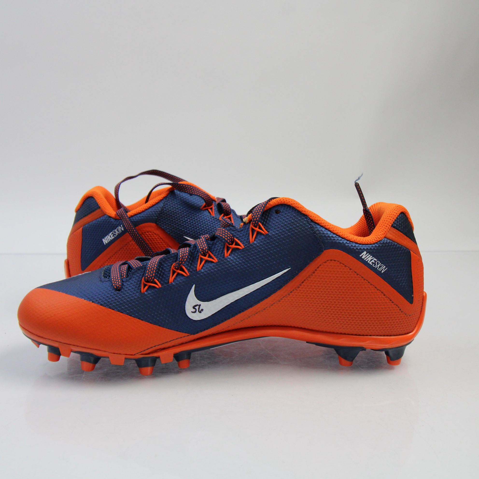 mens orange and black football cleats