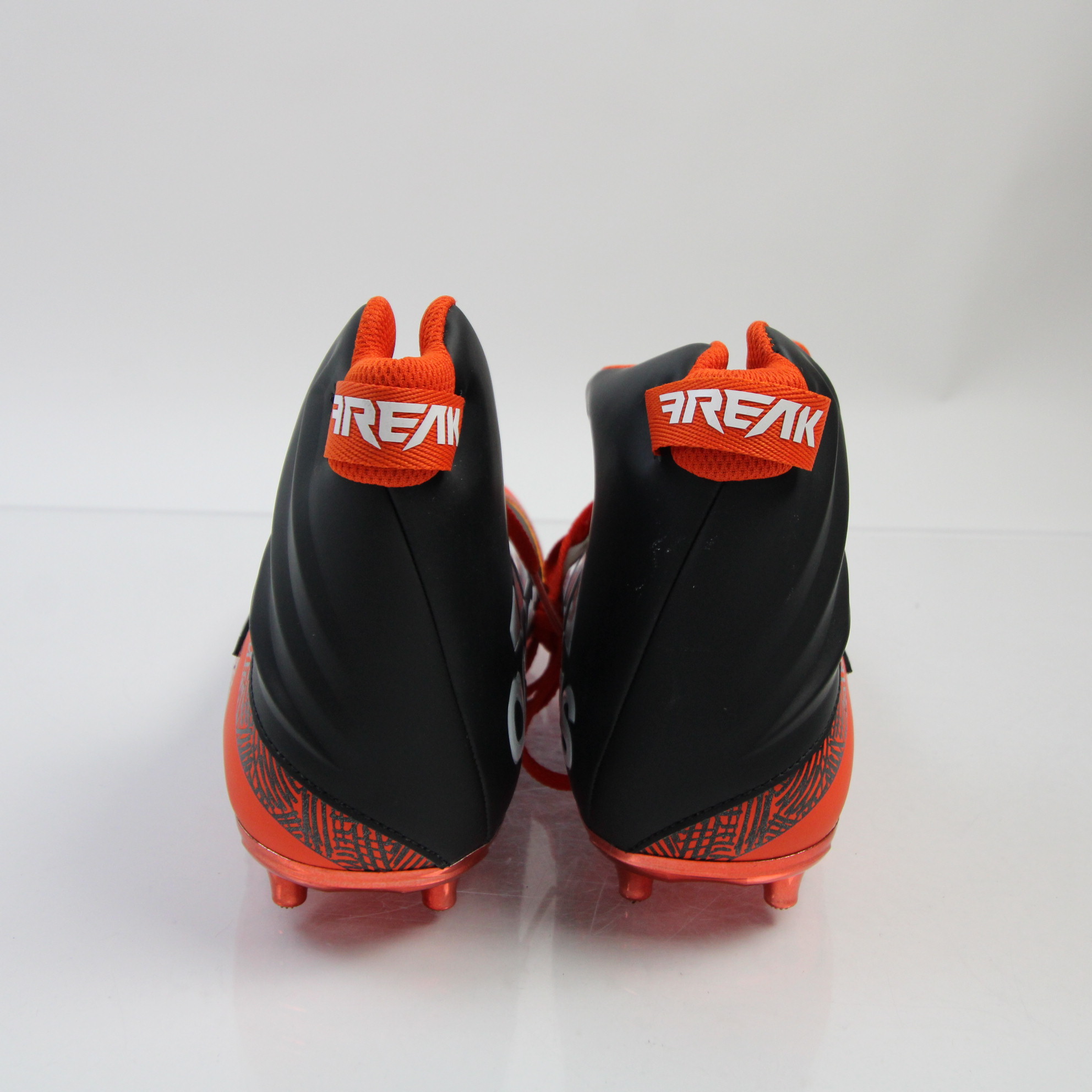 mens orange and black football cleats