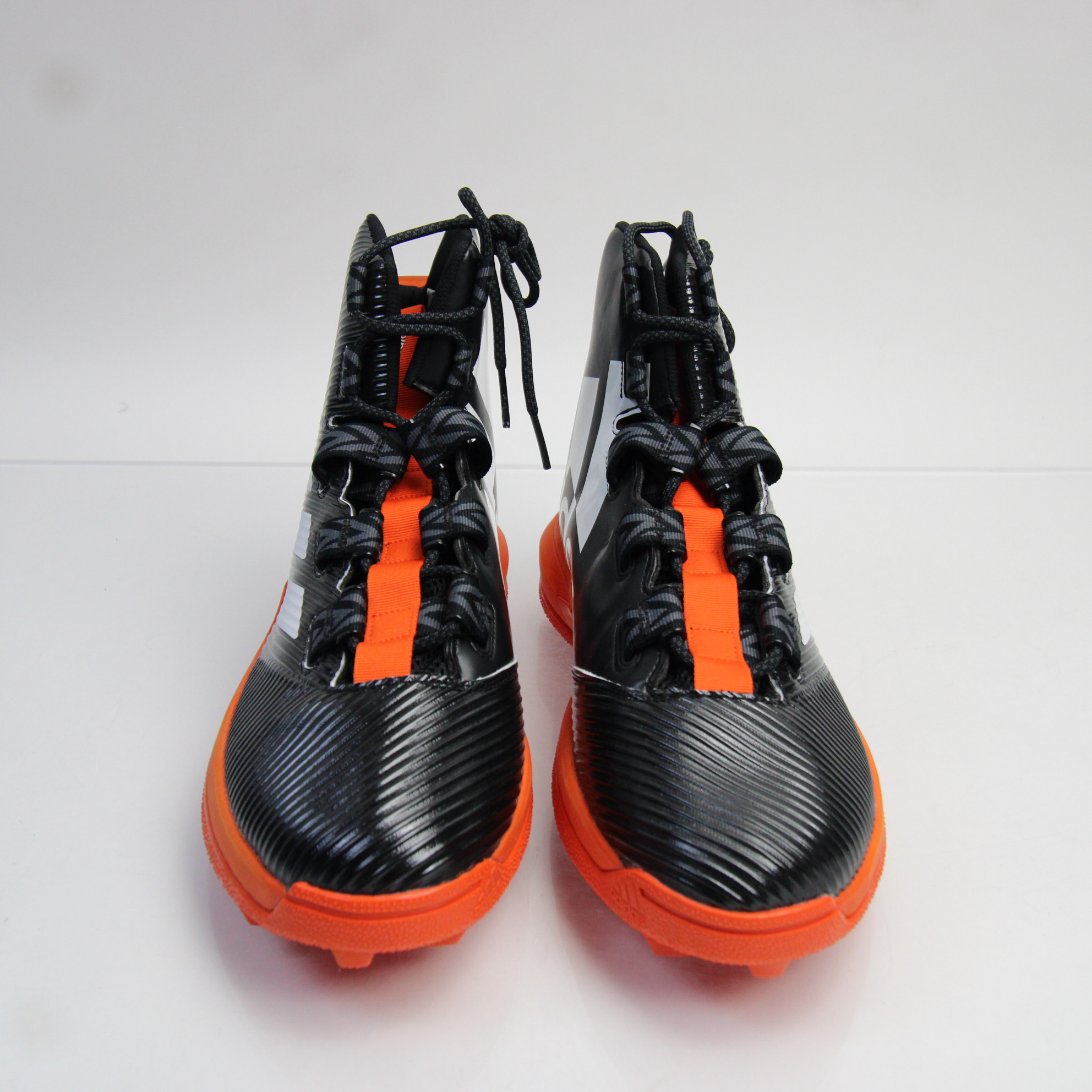 mens orange and black football cleats