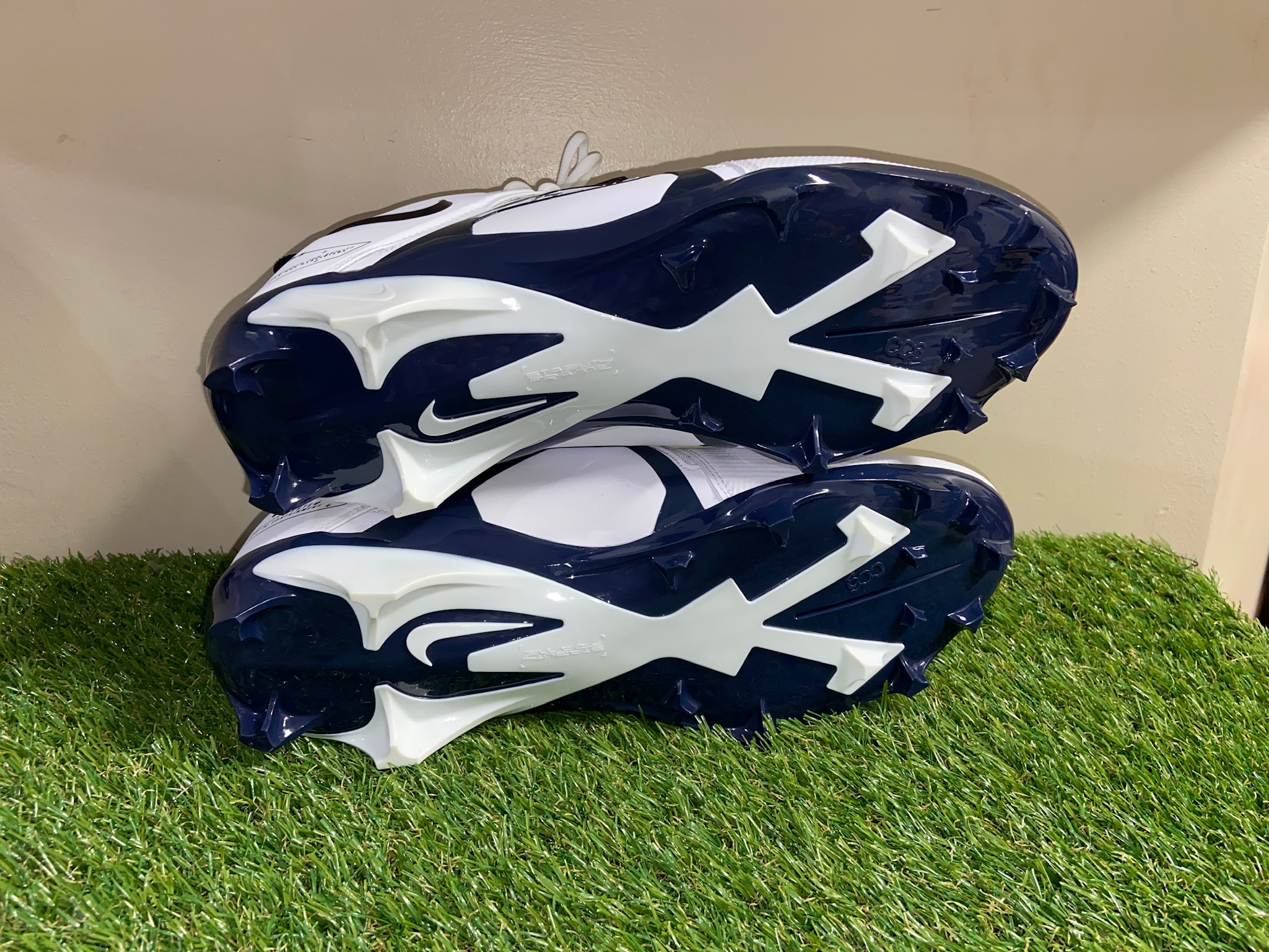 alpha pro football cleats