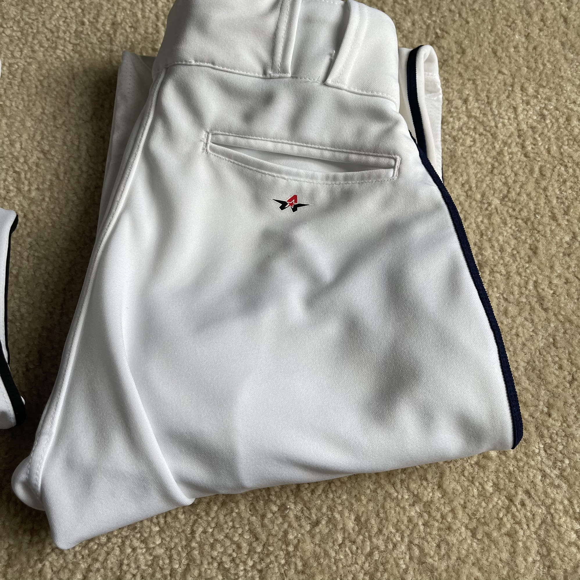 (2) pair used Baseball pants (1) Navy Piping (1) Black Piping