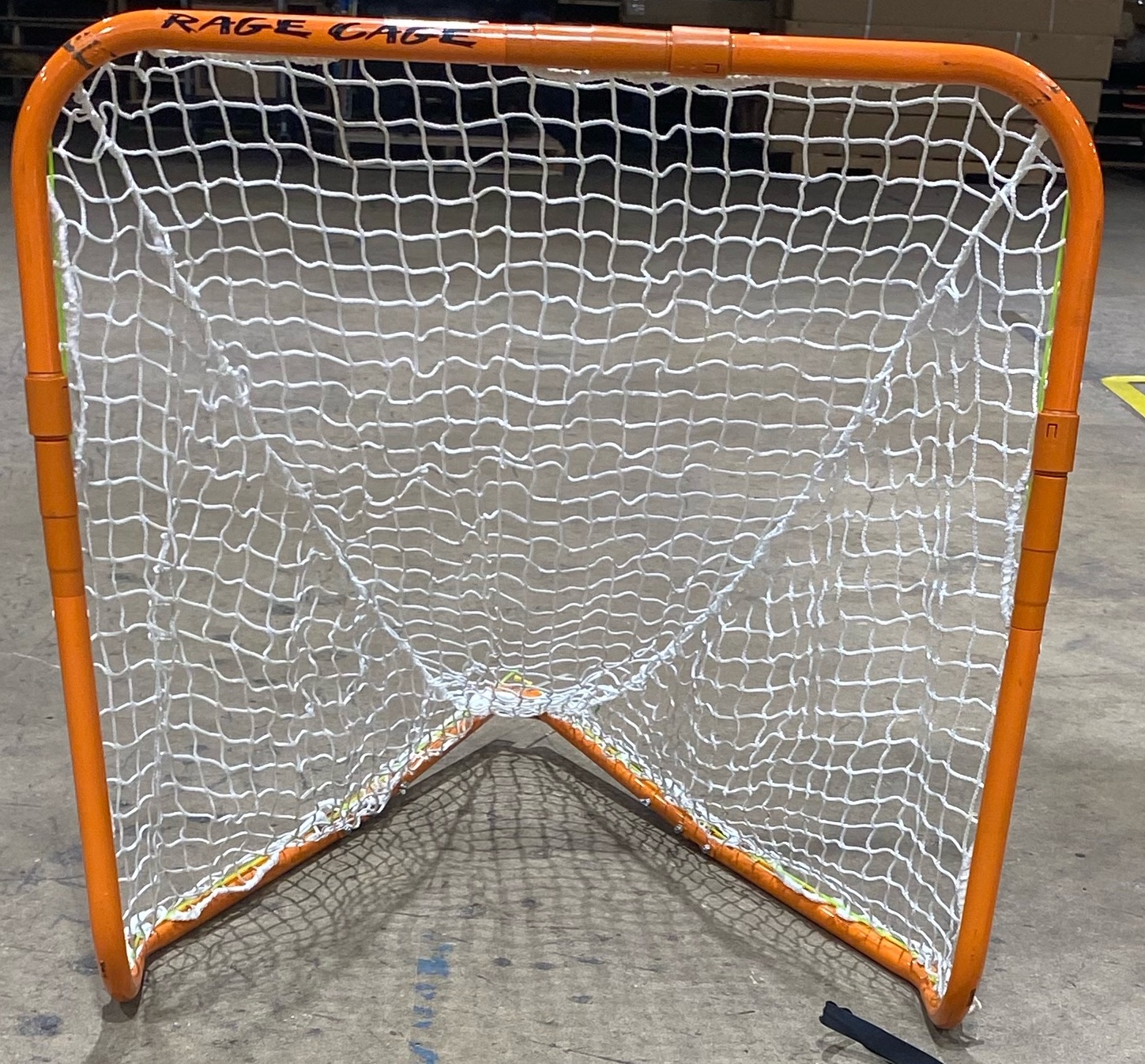 A preowned Rage Cage Mini Lacrosse Goal that's foldable, fully