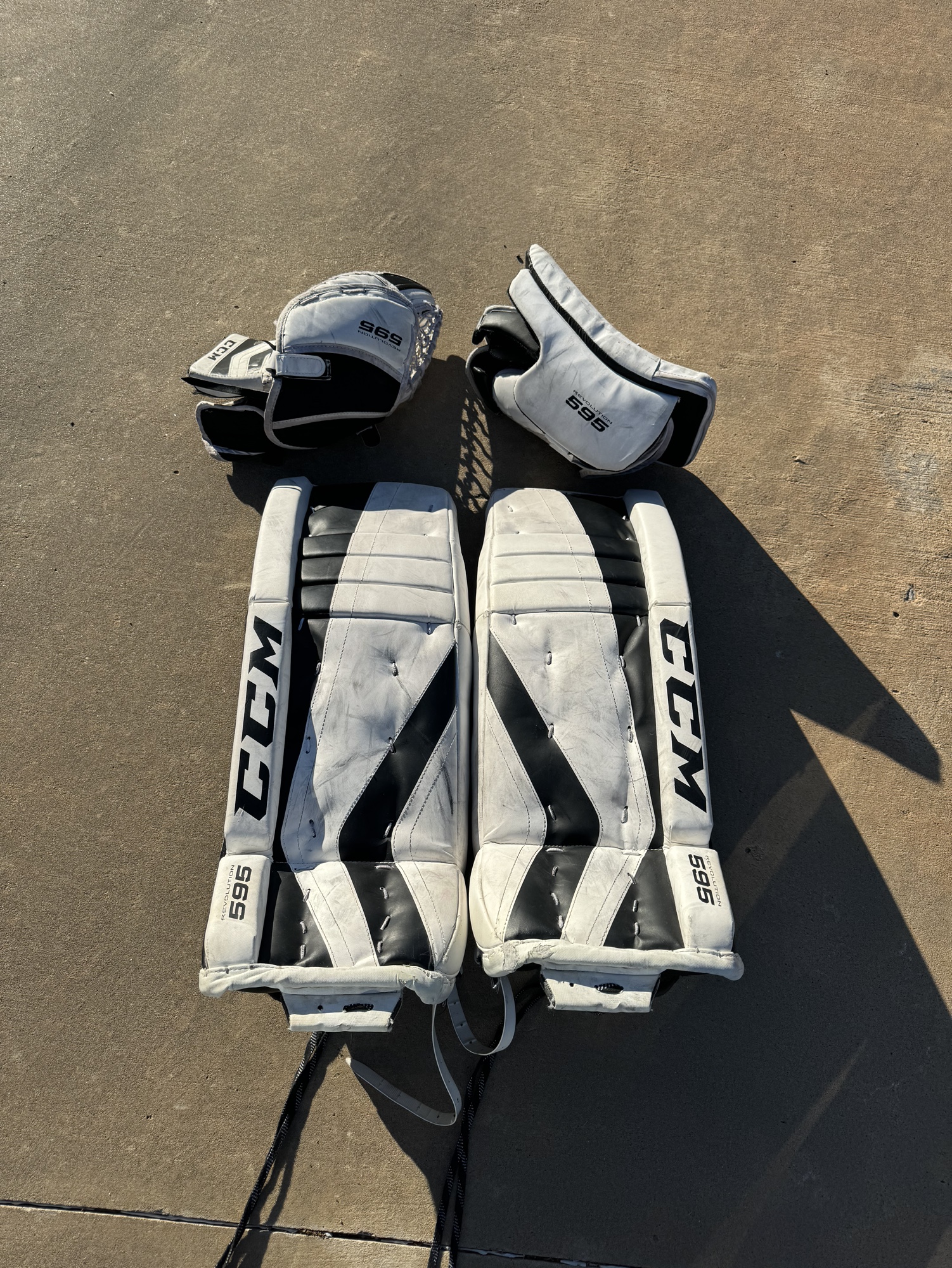 Used CCM Regular Junior 28+1 Revolution 595 Goalie Leg pads, glove and
