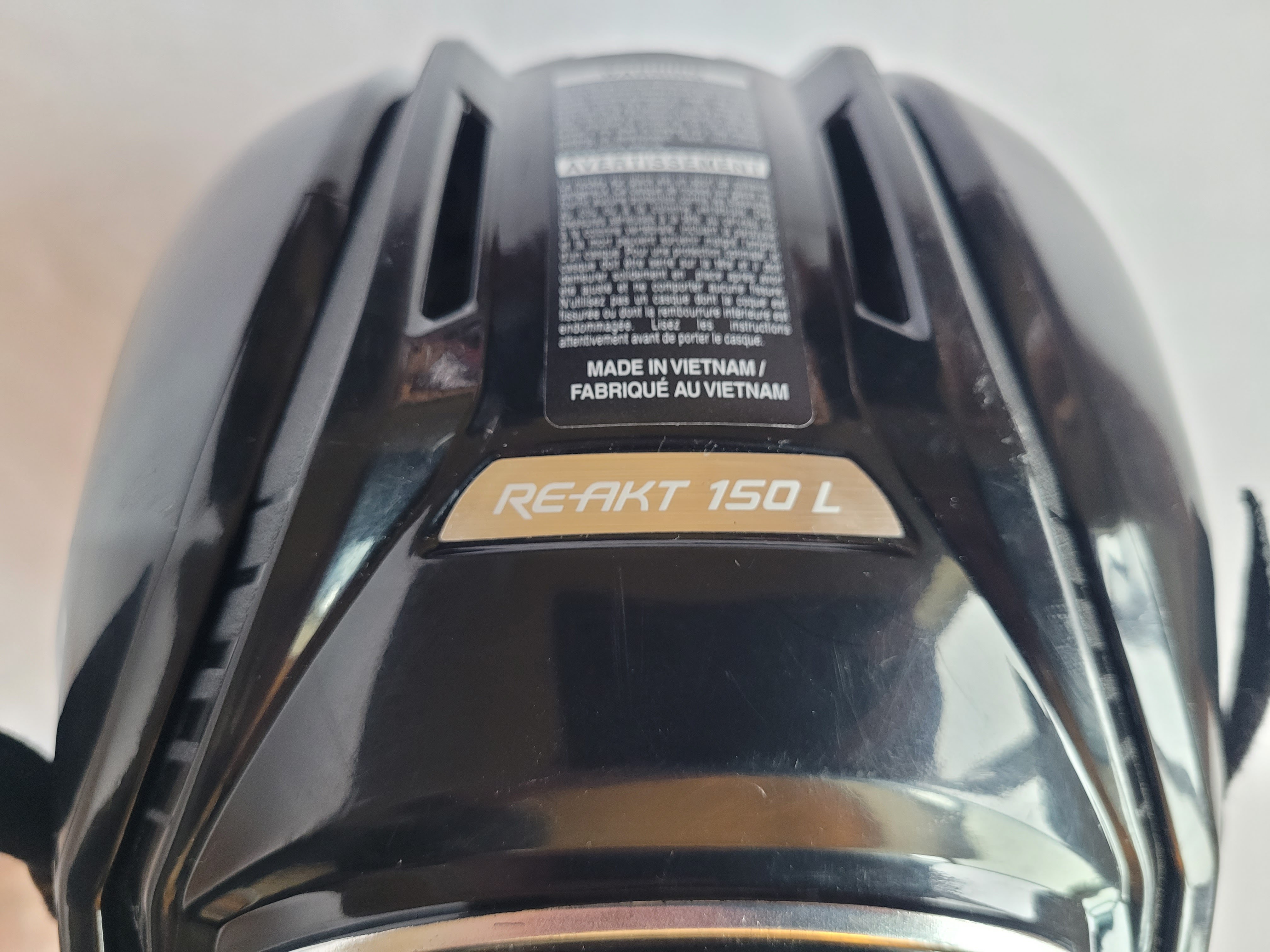 used Large Bauer ReAkt 150 black helmet + Profile II i2 cage