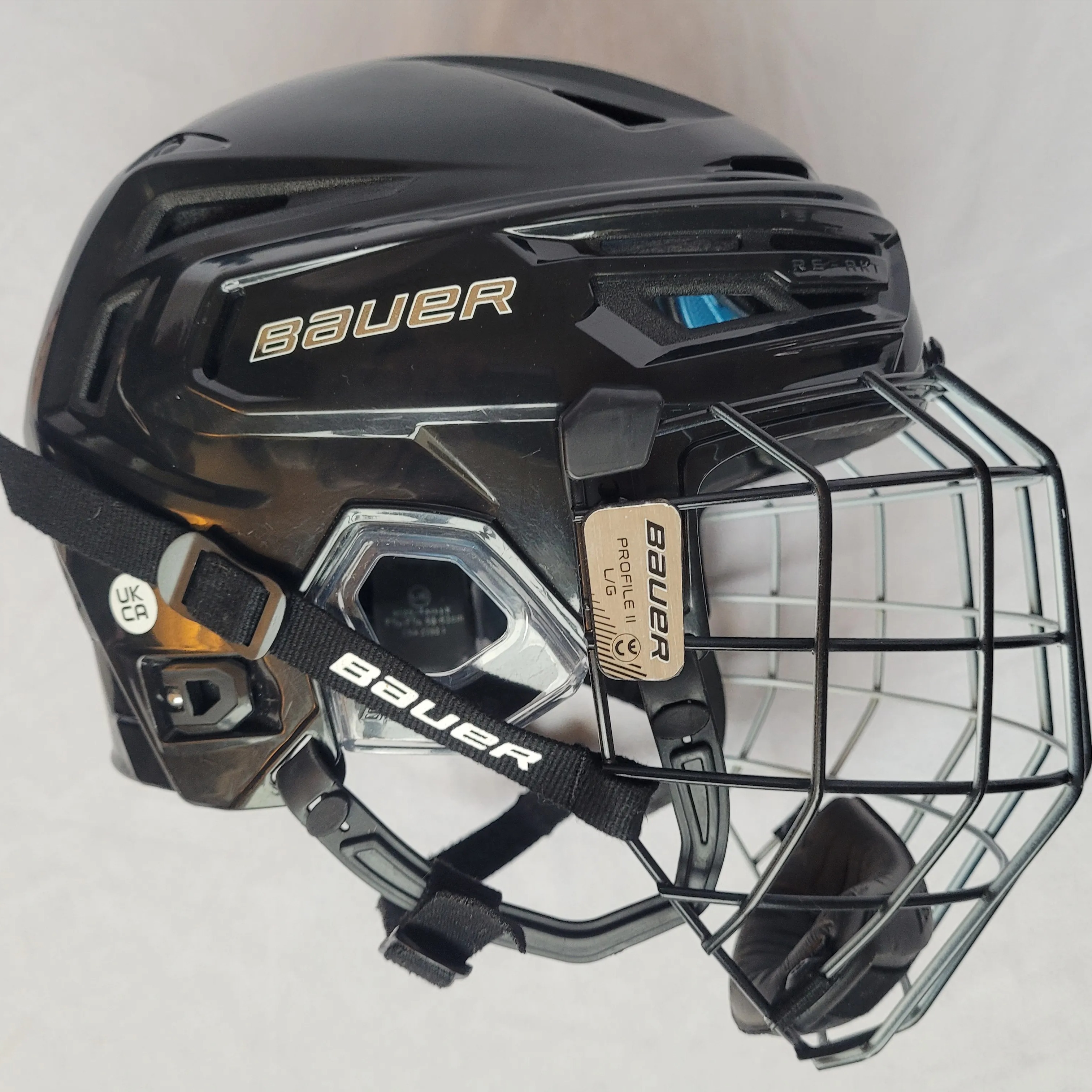 used Large Bauer ReAkt 150 black helmet + Profile II i2 cage