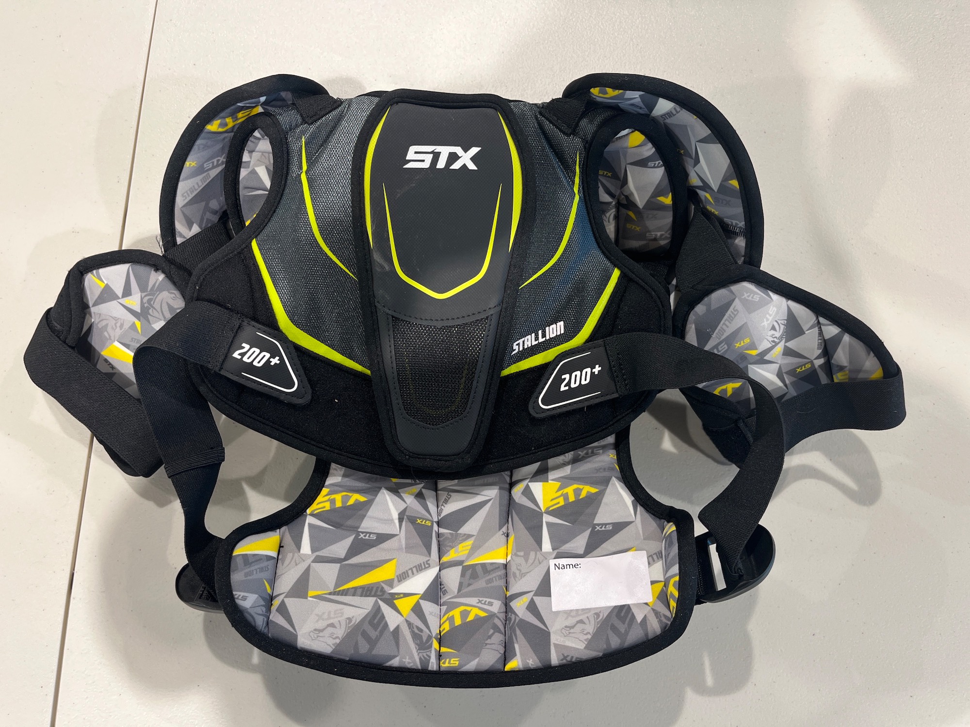 Used Medium STX Stallion 200 gloves, shoulder pads, and arm pads