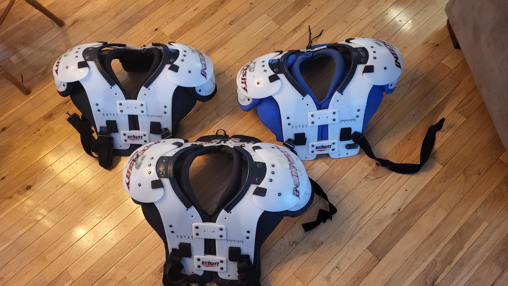 3Adult Used Large Schutt DNA Pro Helmets and 3 sets of Schutt Intensity (M) Shoulder Pads