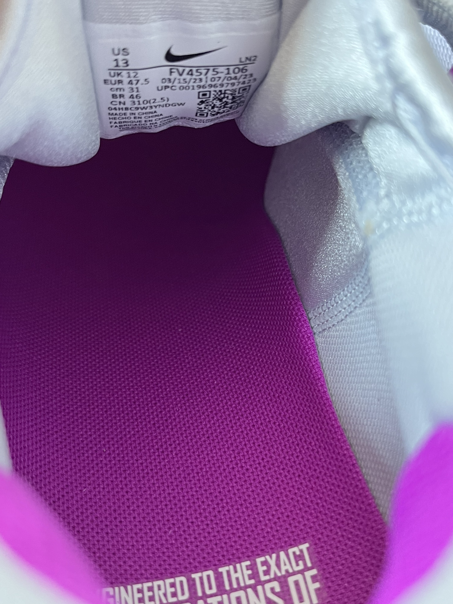 white and rainbow nike cleats