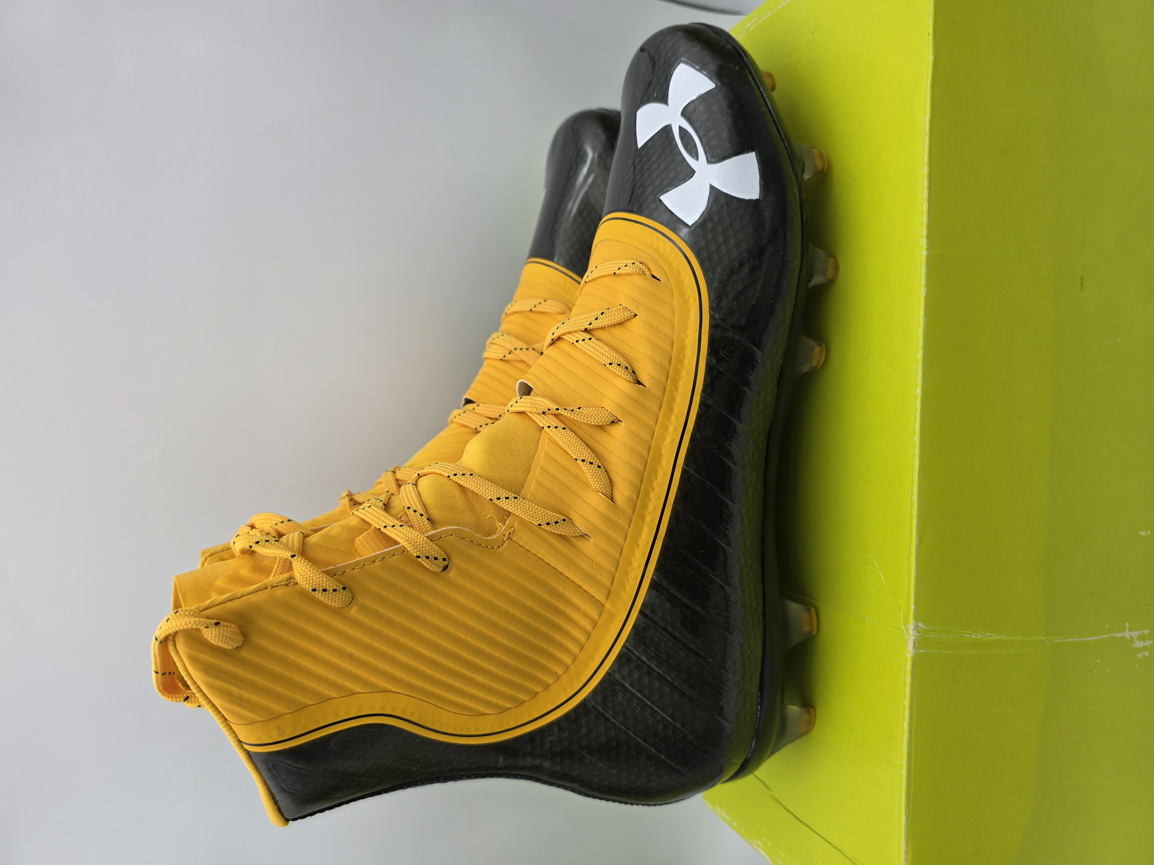 under armour orange and black cleats